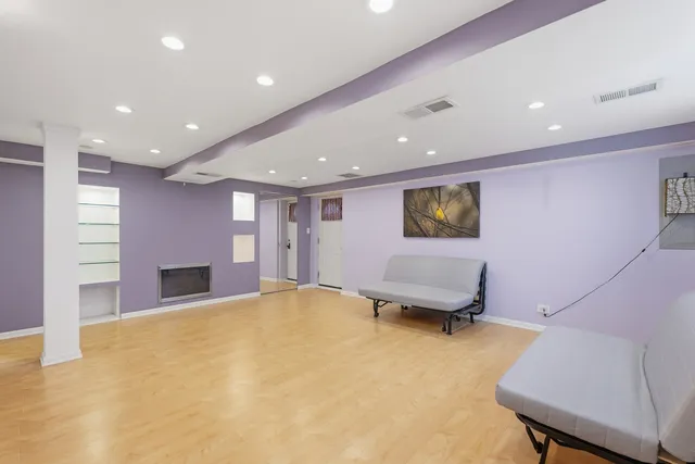 a bedroom with a bed and a chair