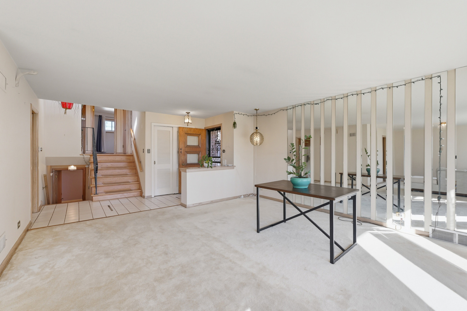 9020 South Constance Avenue Chicago, IL 60617 - Photo 4 of 26 a view of a livingroom with furniture and stairs