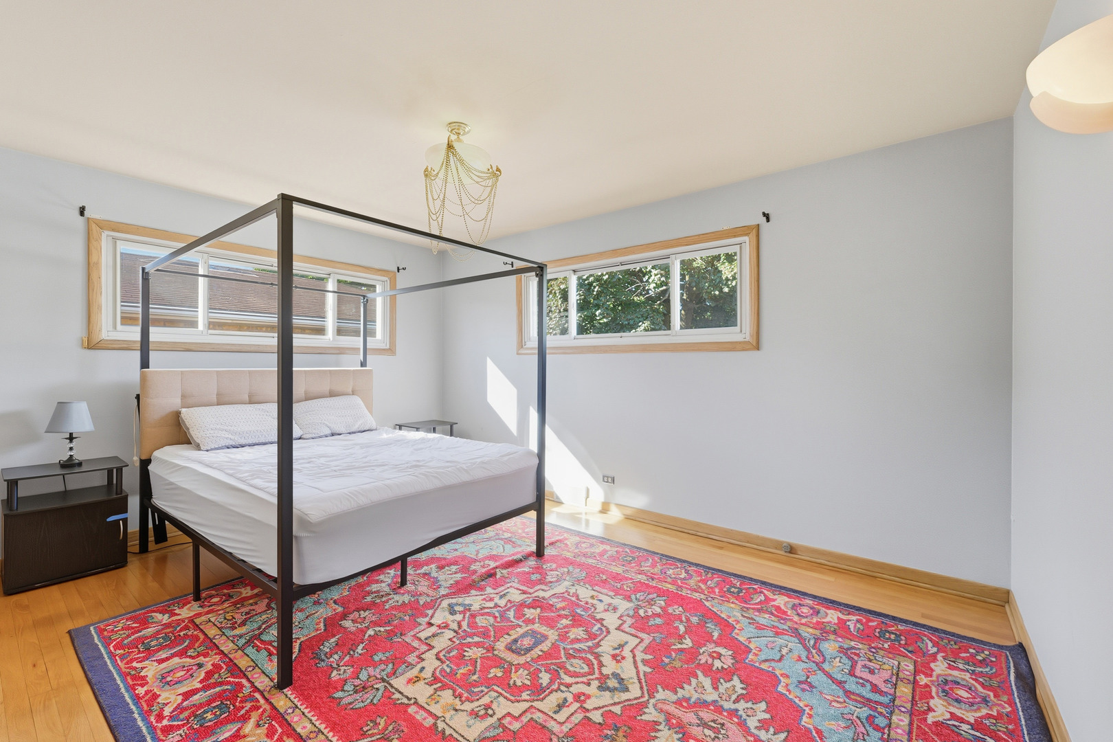 9020 South Constance Avenue Chicago, IL 60617 - Photo 8 of 26 a bedroom with a bed and a lamp