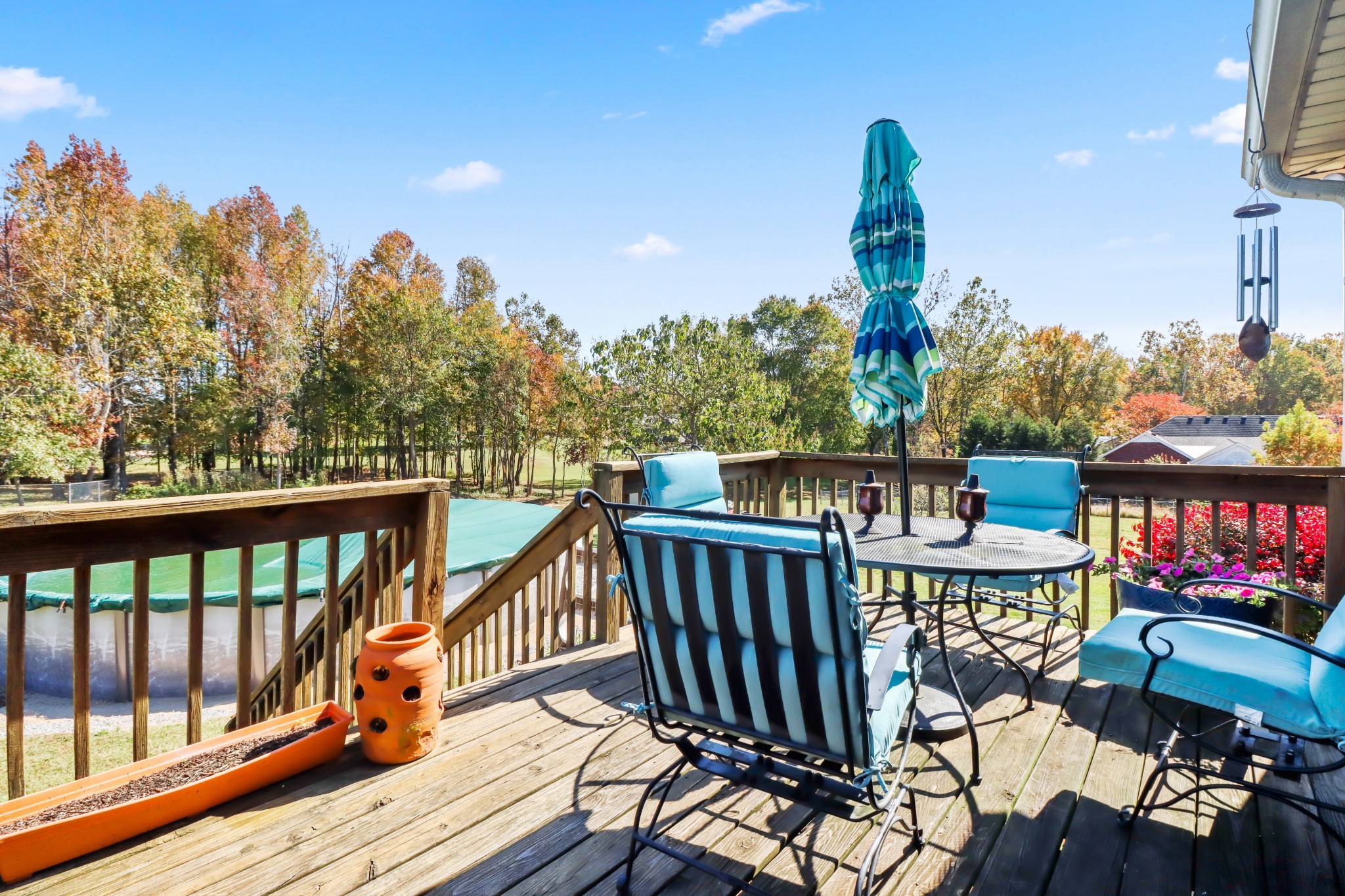 4591 Washington Road Greenbrier, TN 37073 - Photo 12 of 14 a view of a balcony with wooden floor and outdoor seating