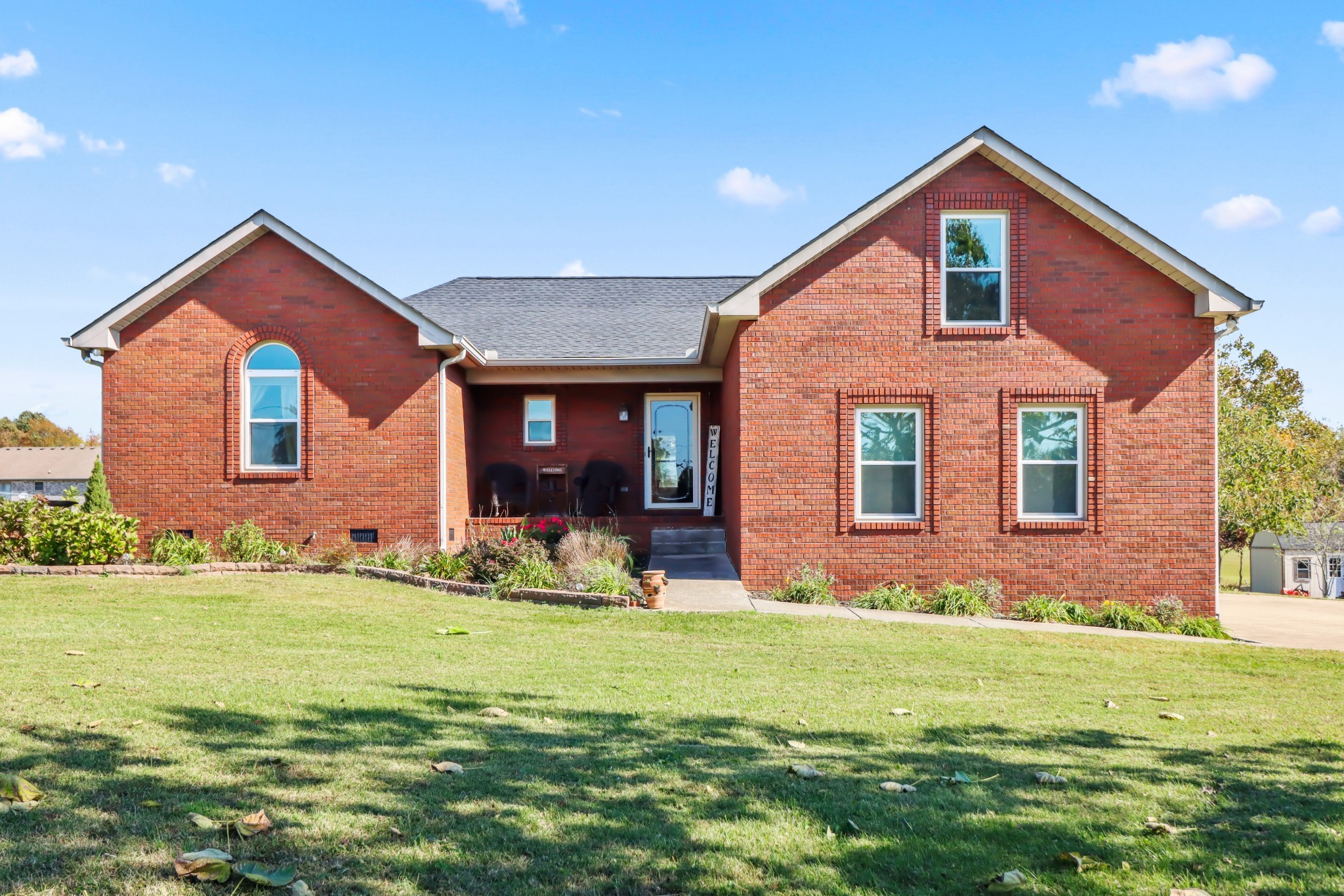 4591 Washington Road Greenbrier, TN 37073 - Photo 14 of 14 a front view of a house with garden