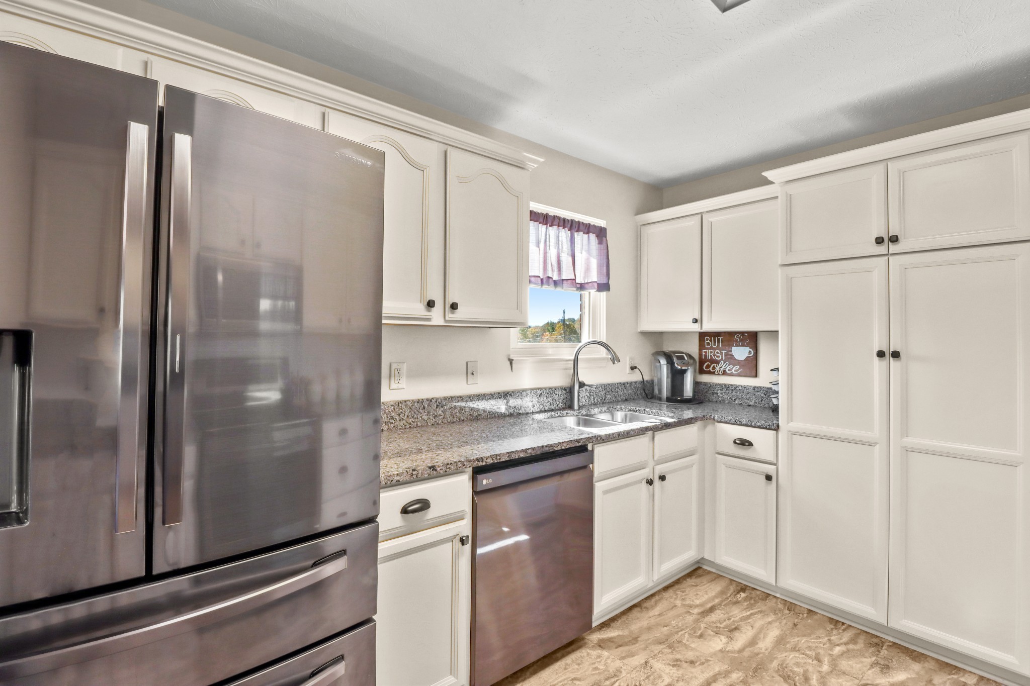 4591 Washington Road Greenbrier, TN 37073 - Photo 3 of 14 a kitchen with a sink a refrigerator and cabinets
