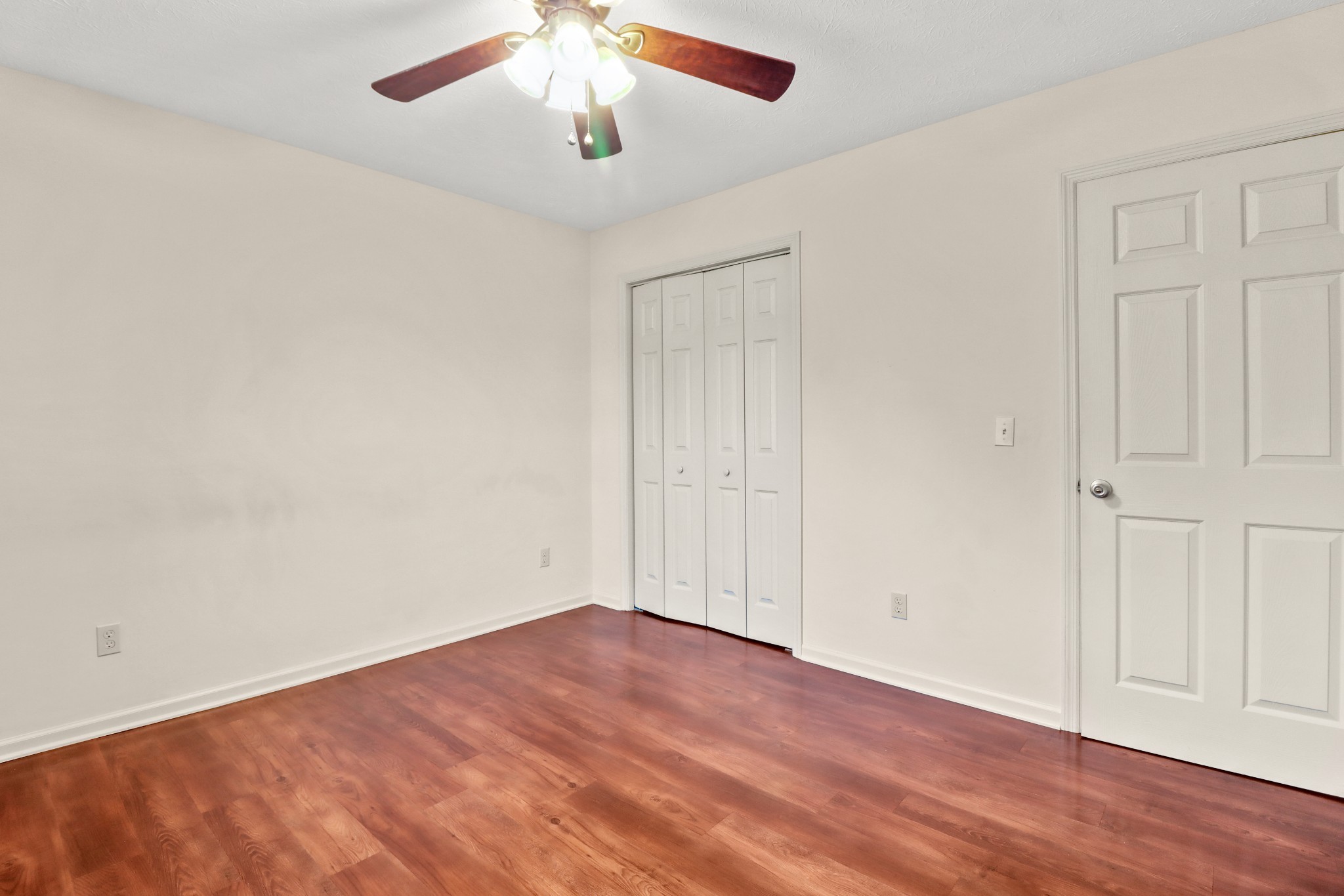 4591 Washington Road Greenbrier, TN 37073 - Photo 5 of 14 an empty room with wooden floor and windows