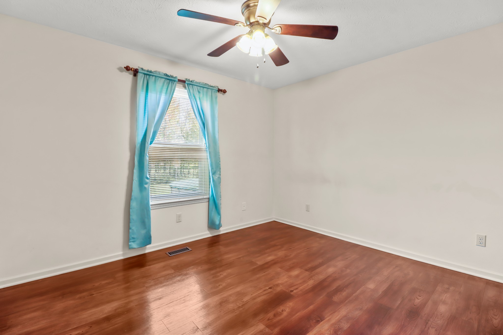 4591 Washington Road Greenbrier, TN 37073 - Photo 6 of 14 an empty room with a window and a fan