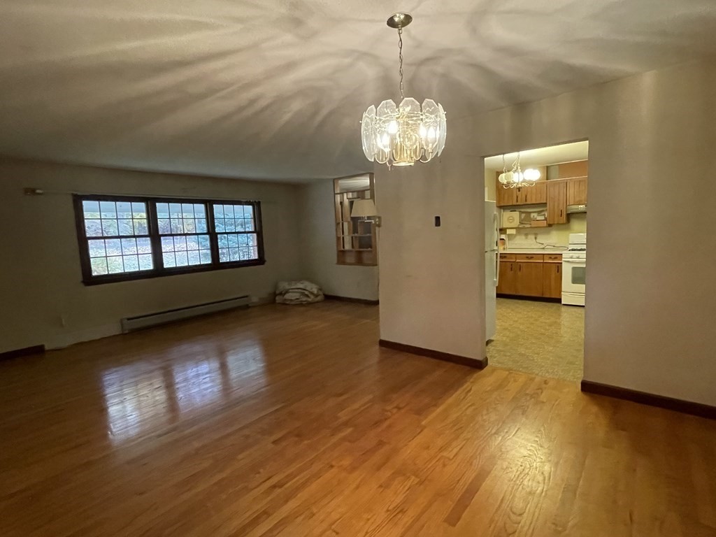 58 Linseed Road West Hatfield, MA 01088 - Photo 5 of 26 a view of a room with wooden floor and windows