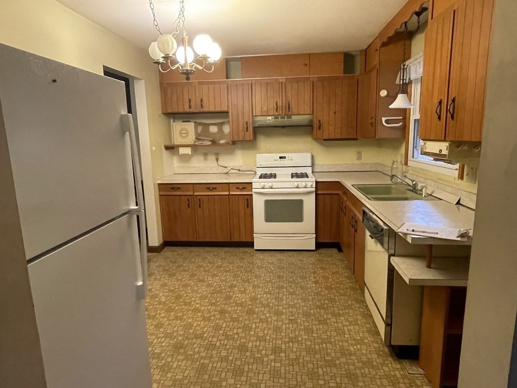 58 Linseed Road West Hatfield, MA 01088 - Photo 9 of 26 a kitchen with stainless steel appliances granite countertop a sink a stove a refrigerator and a refrigerator