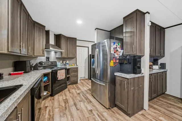 a kitchen with a stove and a sink