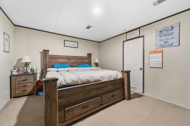 a bathroom with a granite countertop double vanity sink mirror and