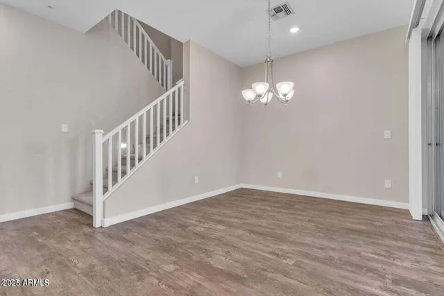 a kitchen with stainless steel appliances granite countertop a sink refrigerator and microwave