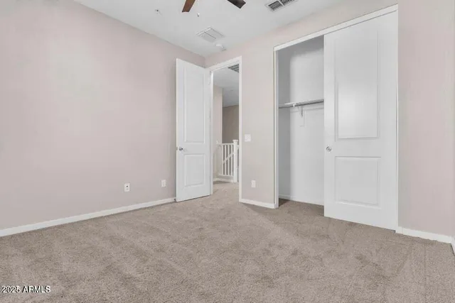 a view of an empty walk in closet