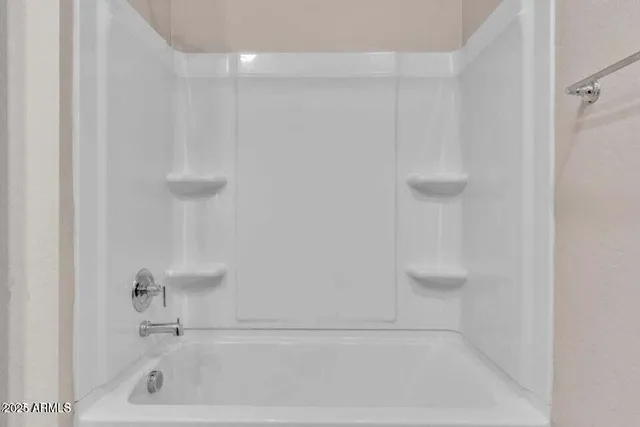 an empty room with closet area