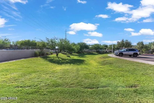 an aerial view of multiple houses with yard
