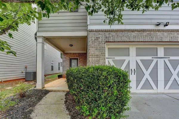 a front view of a house with garden