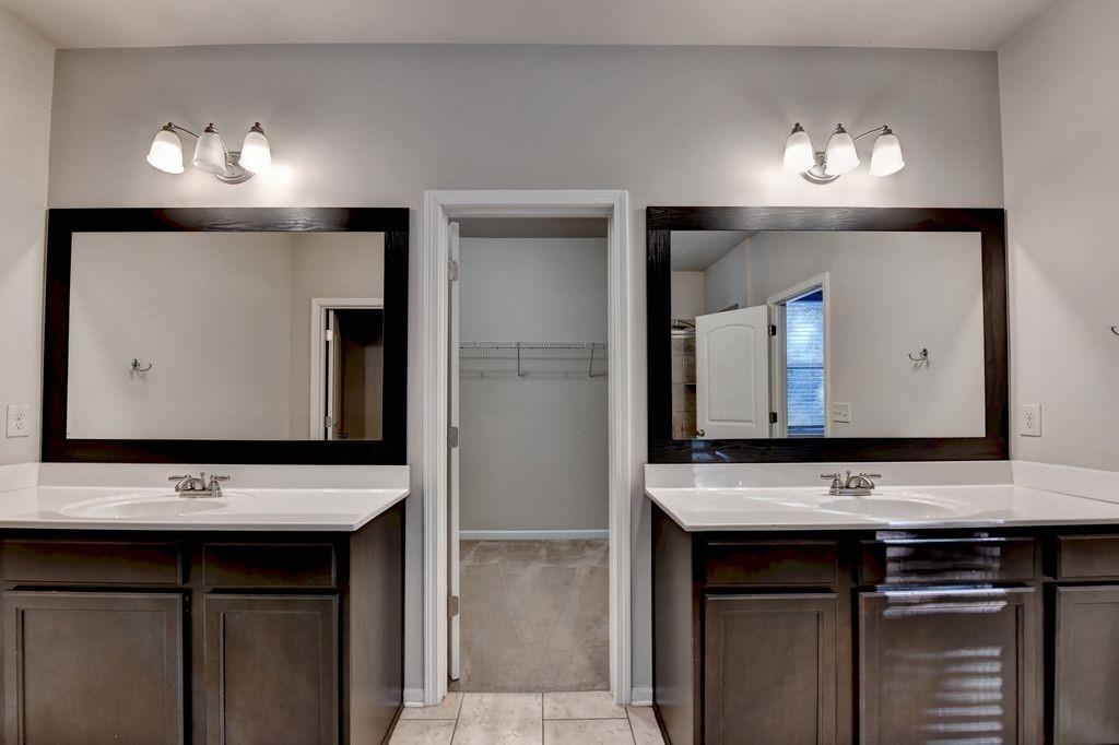 5166 Apple Grove Road Northeast Buford, GA 30519 - Photo 25 of 29 a bathroom with a sink and a mirror