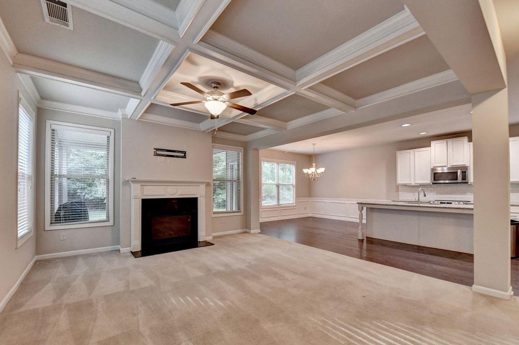 5166 Apple Grove Road Northeast Buford, GA 30519 - Photo 4 of 29 a view of an empty room fire place and a kitchen