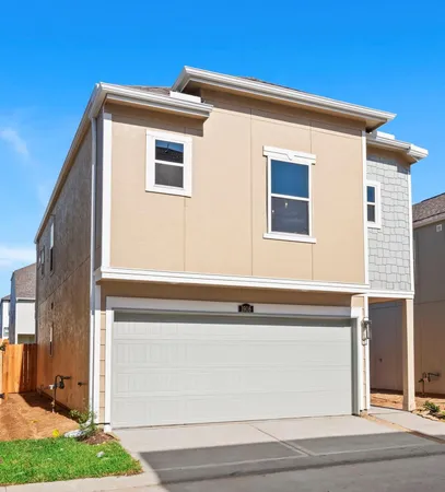 a view of the house with a backyard