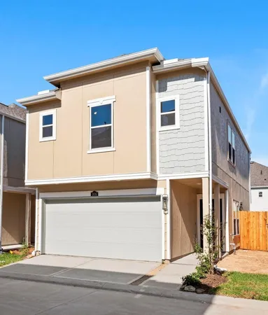 a front view of a house with a garage