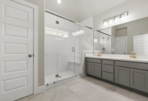 a bathroom with a double vanity sink mirror and double