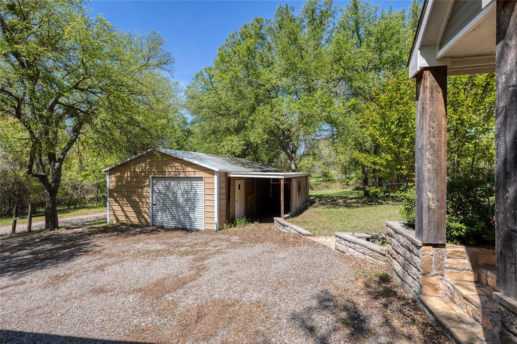 1701 Central Road Weatherford, TX 76088 - Photo 2 of 40 Workshop with two roll up doors and open storage area.