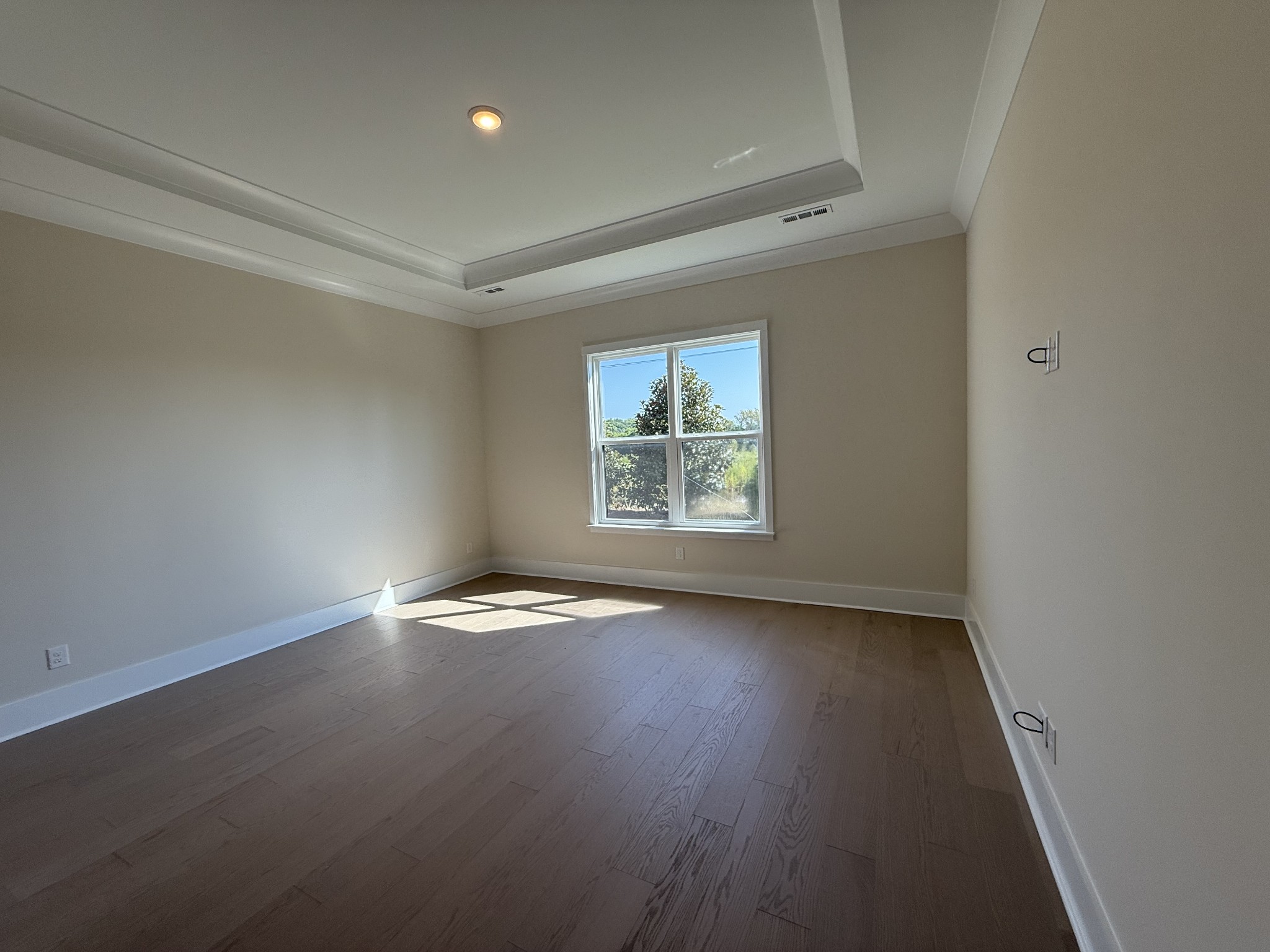 7744 Second Fiddle Way Arrington, TN 37014 - Photo 18 of 31 an empty room with wooden floor and windows