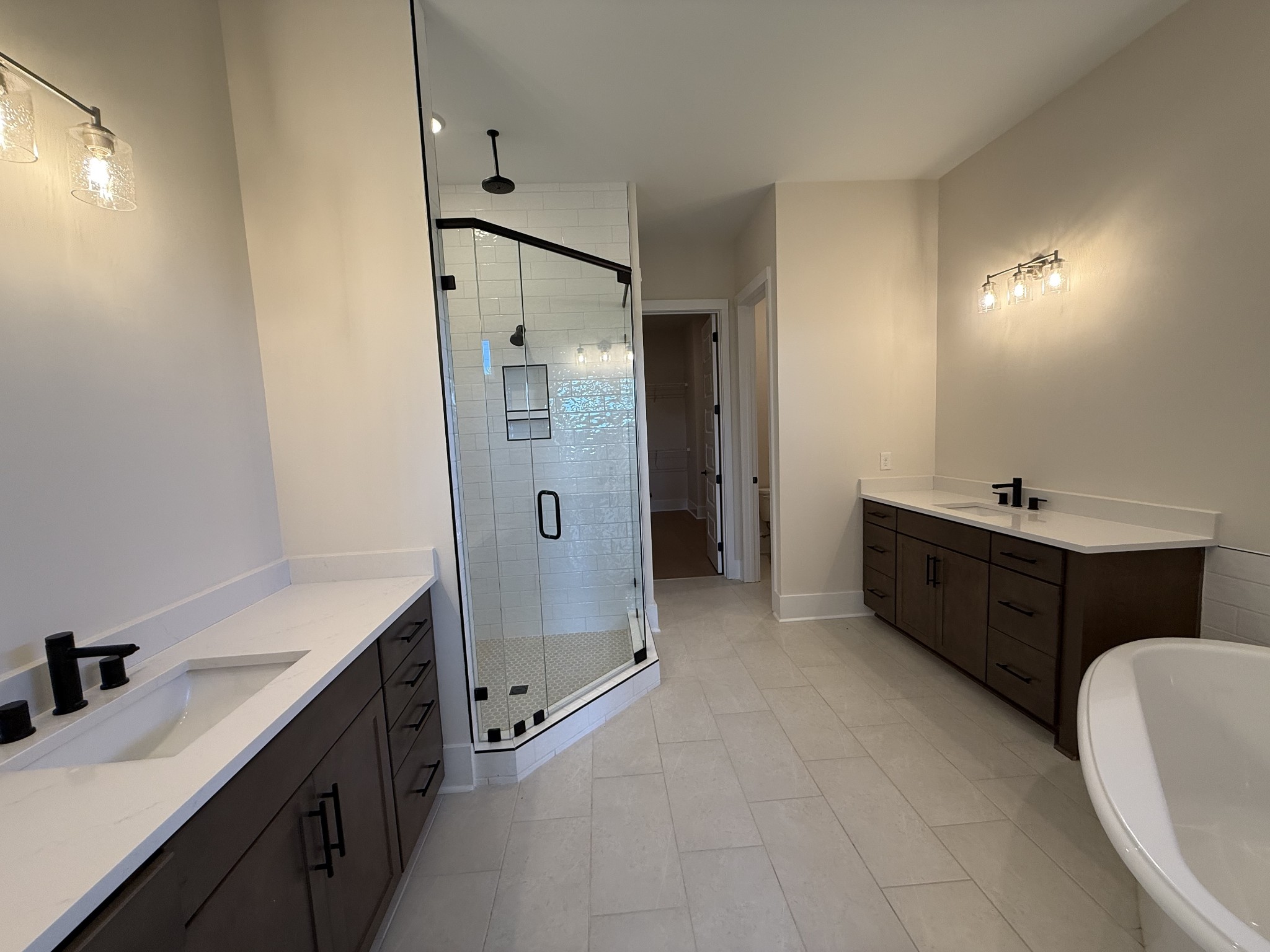 7744 Second Fiddle Way Arrington, TN 37014 - Photo 20 of 31 a spacious bathroom with a double vanity sink mirror double and shower