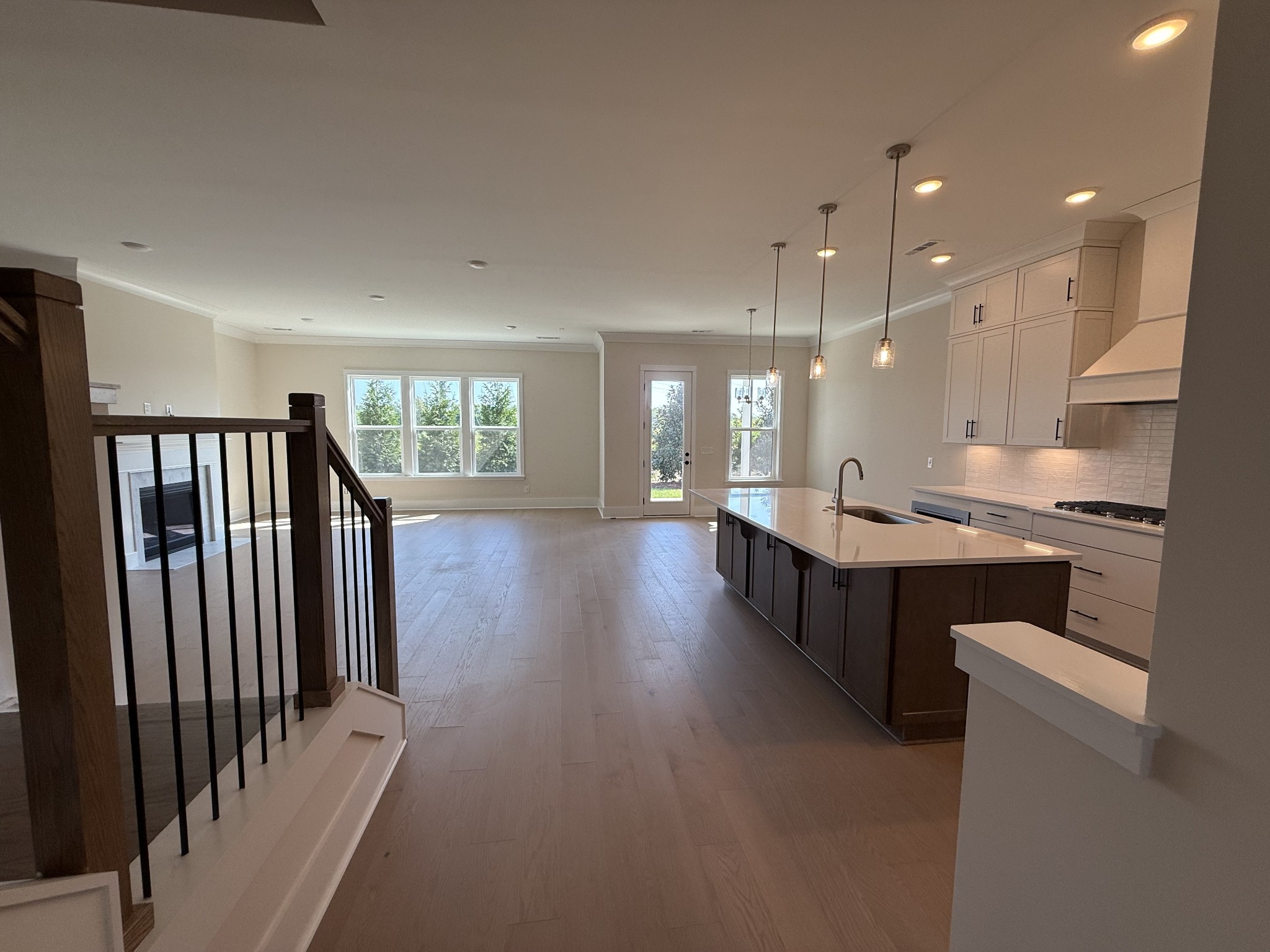 7744 Second Fiddle Way Arrington, TN 37014 - Photo 10 of 31 a open kitchen with kitchen island a sink stainless steel appliances and a refrigerator