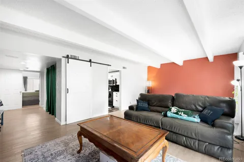 a living room with furniture and a rug