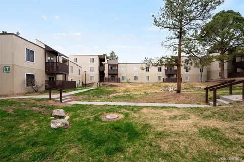 a swimming pool with some trees in the background