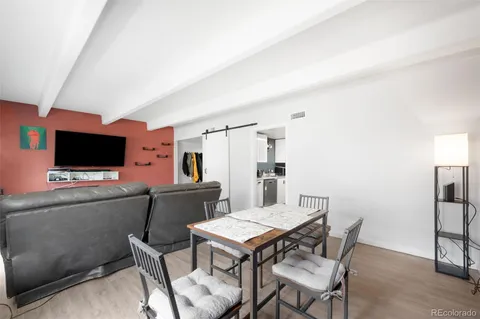 a room with furniture and a flat screen tv