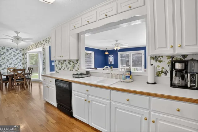 a kitchen with stainless steel appliances a stove and a refrigerator