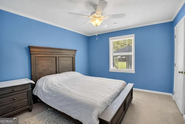 a bathroom with a granite countertop sink a toilet and a mirror