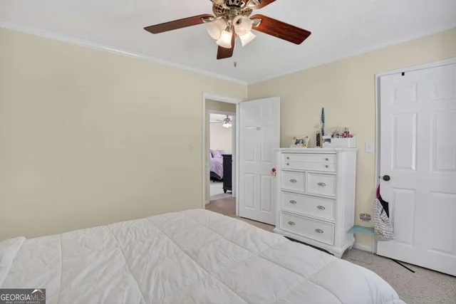 a spacious bedroom with a bed and window