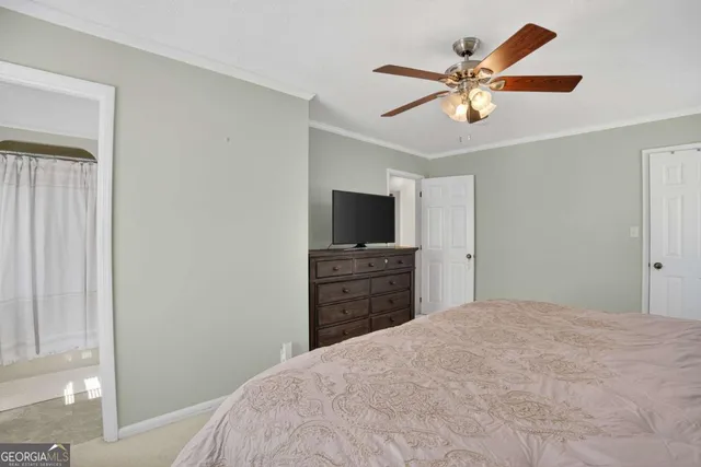 a bathroom with a sink a toilet and shower curtain