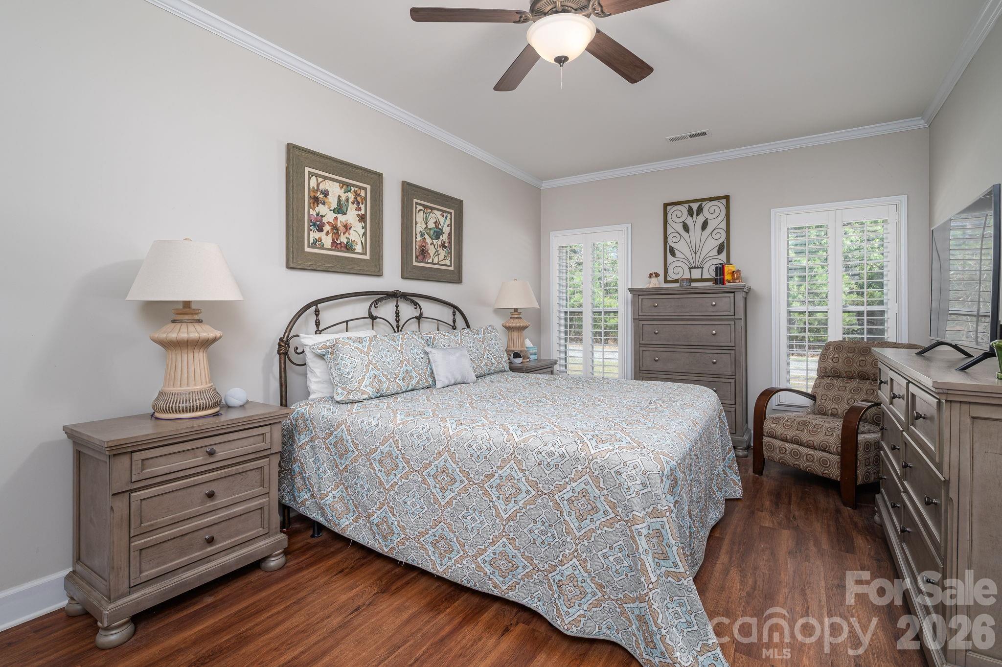 140 Huffstetler Lake Road Dallas, NC 28034 - Photo 13 of 22 a bedroom with a bed wooden floor and window