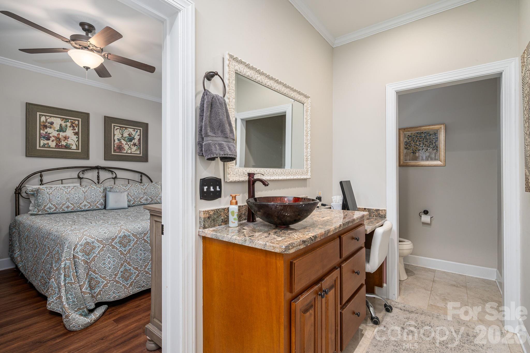 140 Huffstetler Lake Road Dallas, NC 28034 - Photo 14 of 22 a bedroom with a bed and a dresser