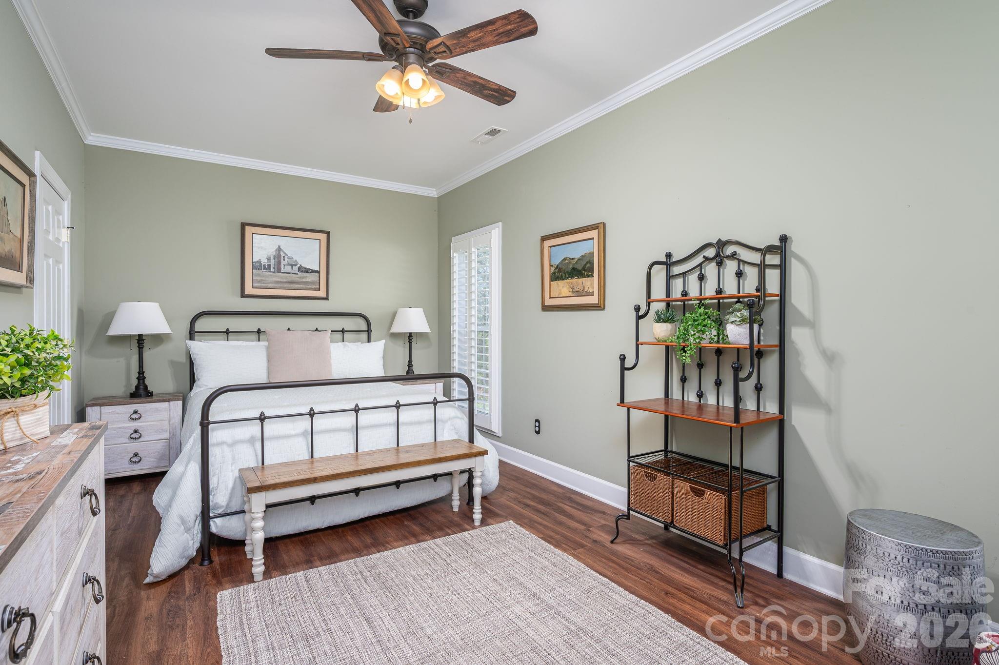 140 Huffstetler Lake Road Dallas, NC 28034 - Photo 16 of 22 a bedroom with a bed and a window