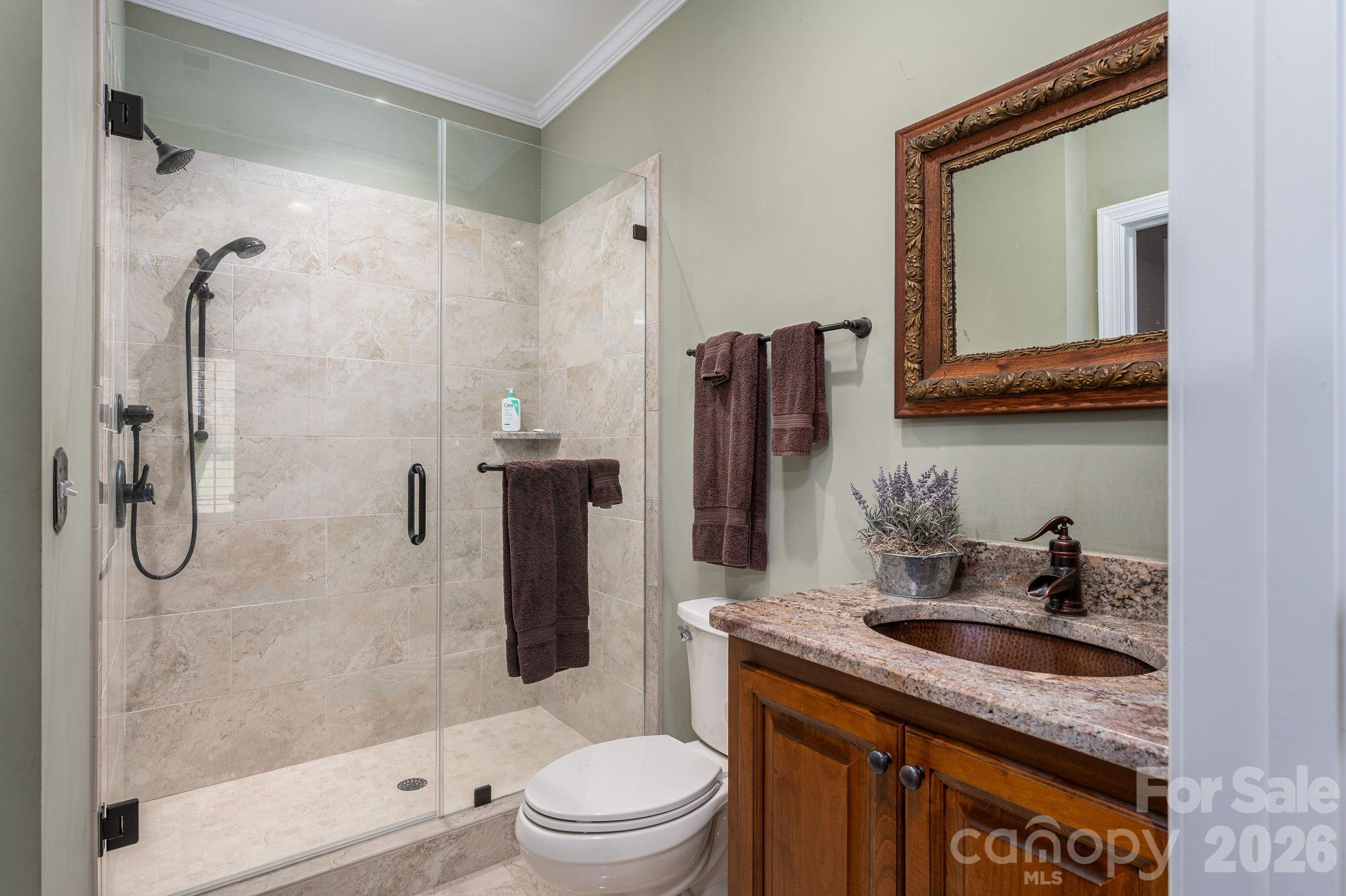 140 Huffstetler Lake Road Dallas, NC 28034 - Photo 17 of 22 a bathroom with a granite countertop sink toilet and shower