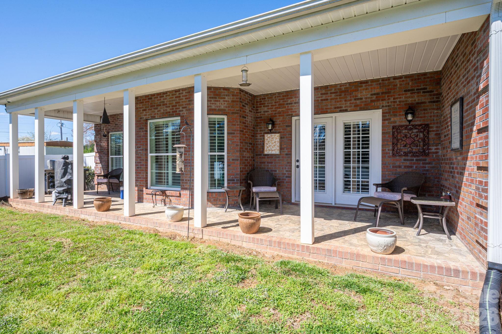 140 Huffstetler Lake Road Dallas, NC 28034 - Photo 19 of 22 front view of a building with sitting area