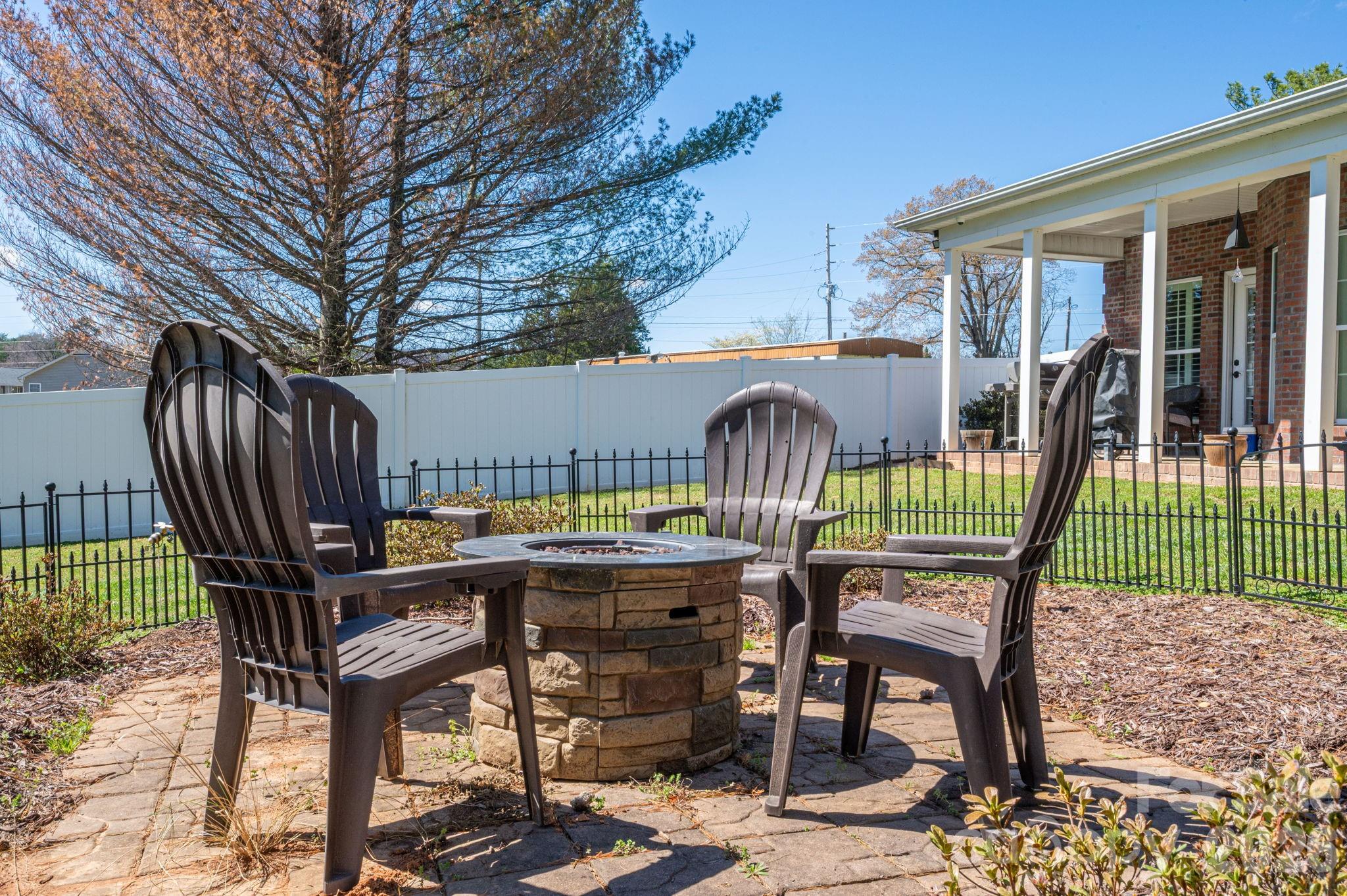 140 Huffstetler Lake Road Dallas, NC 28034 - Photo 20 of 22 a view of a chairs and deck in the backyard