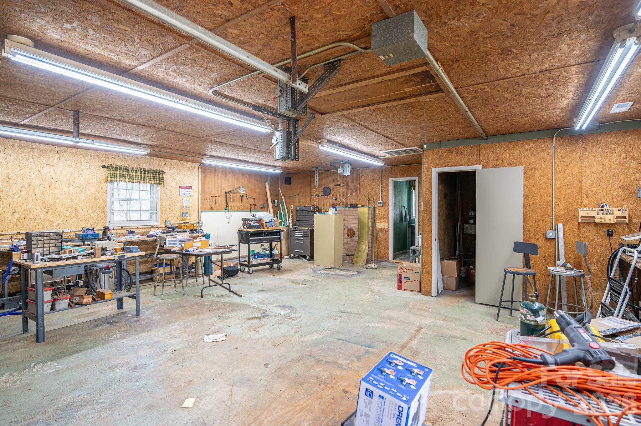 140 Huffstetler Lake Road Dallas, NC 28034 - Photo 22 of 22 a living room with lots of furniture and a window