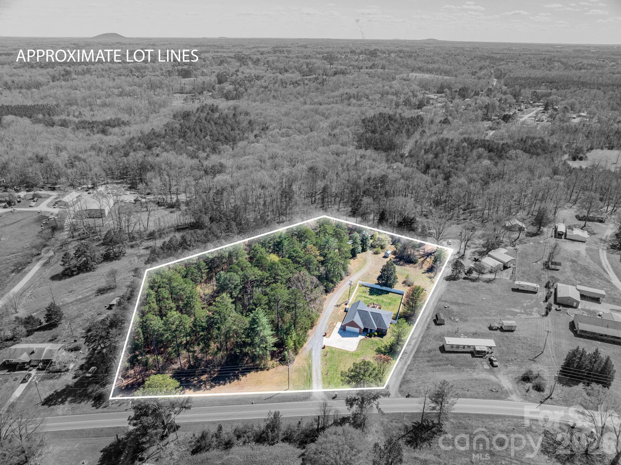 140 Huffstetler Lake Road Dallas, NC 28034 - Photo 3 of 22 a view of a wooden bridge