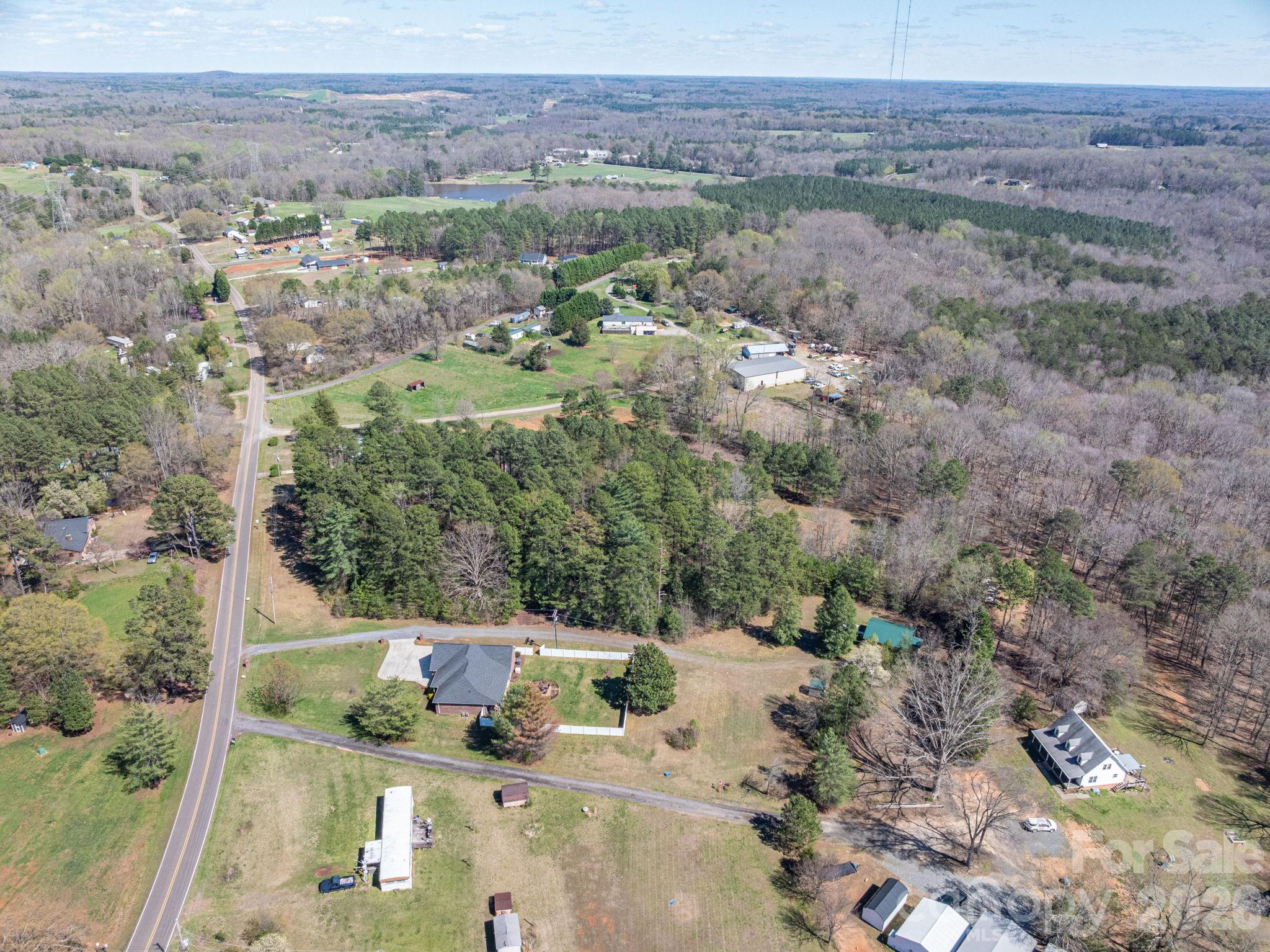 140 Huffstetler Lake Road Dallas, NC 28034 - Photo 4 of 22 a view of a lake with mountain