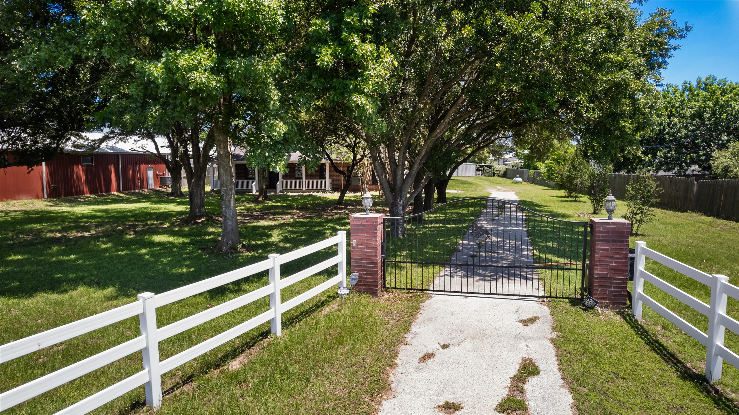 20240 Cypress Rosehill Road Tomball, TX 77377 - Photo 8 of 26 a view of a garden with wooden fence