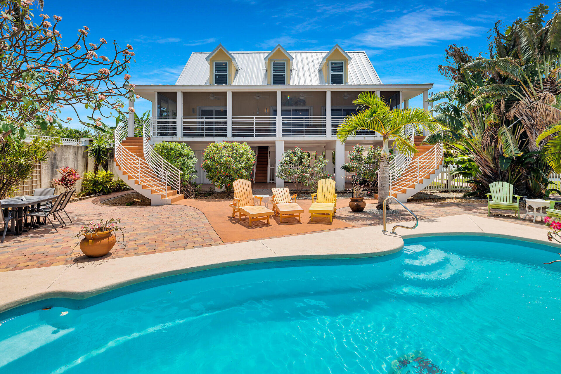 412 122nd Street Marathon, FL 33050 - Photo 2 of 43 a view of a house with backyard porch and sitting area