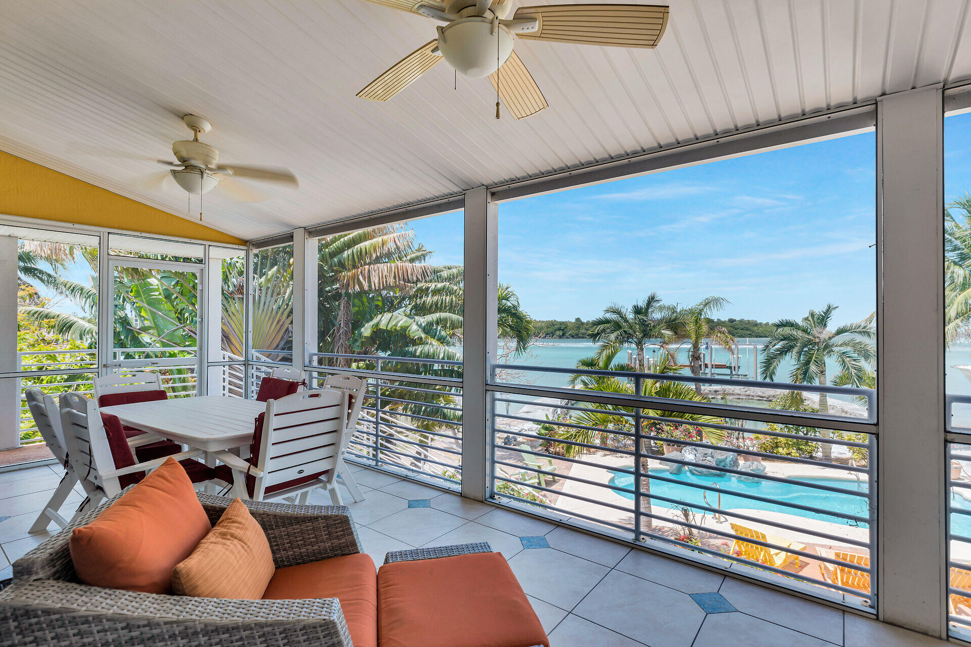 412 122nd Street Marathon, FL 33050 - Photo 26 of 43 a living room with furniture and a floor to ceiling window