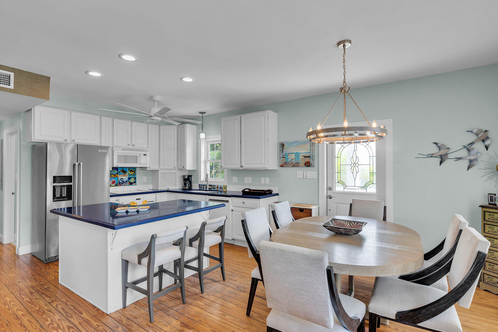 412 122nd Street Marathon, FL 33050 - Photo 5 of 43 a kitchen with stainless steel appliances a dining table chairs and wooden floor