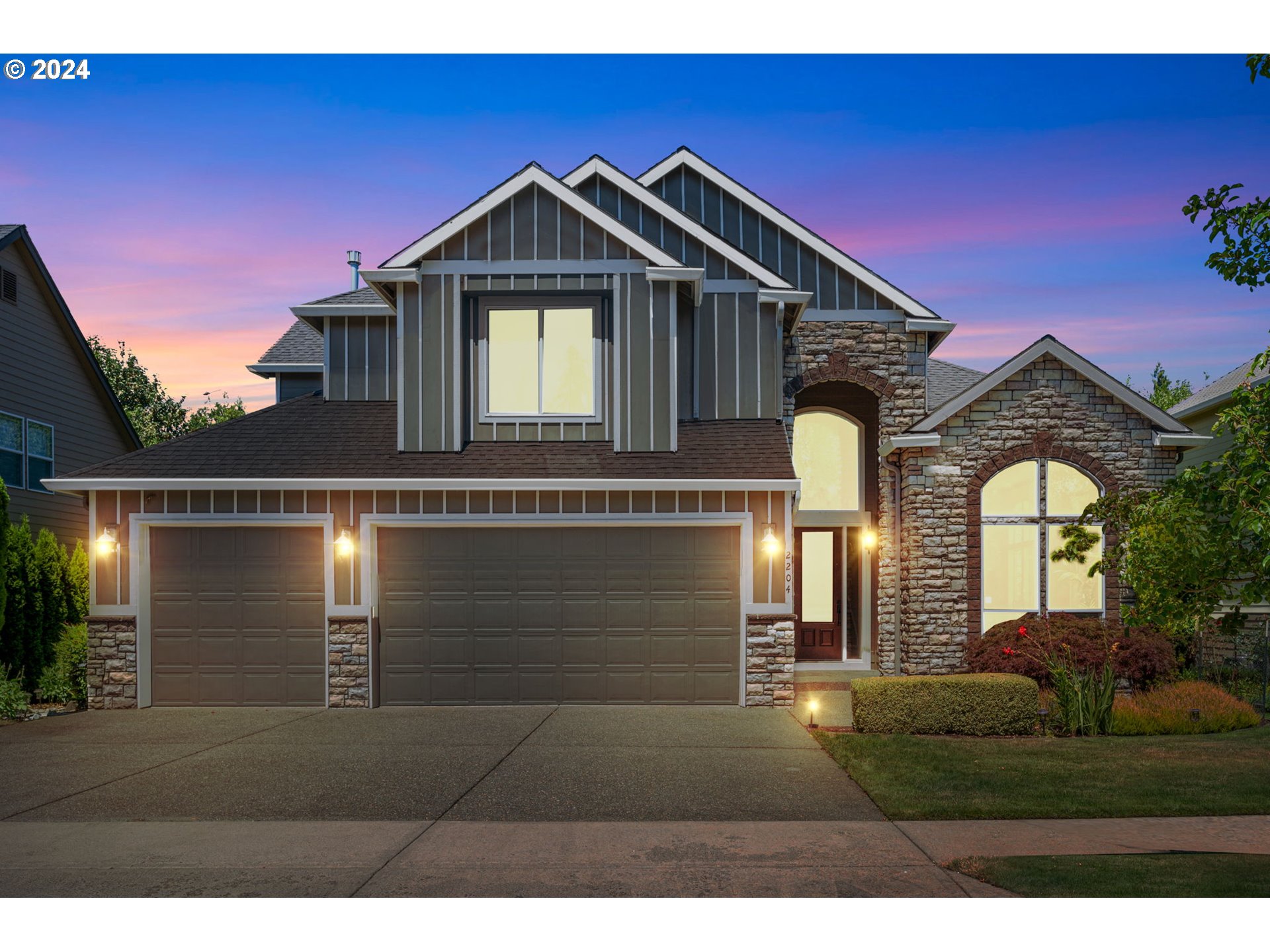 2204 South 17th Way Ridgefield, WA 98642 - Photo 1 of 45 a front view of a house with a yard