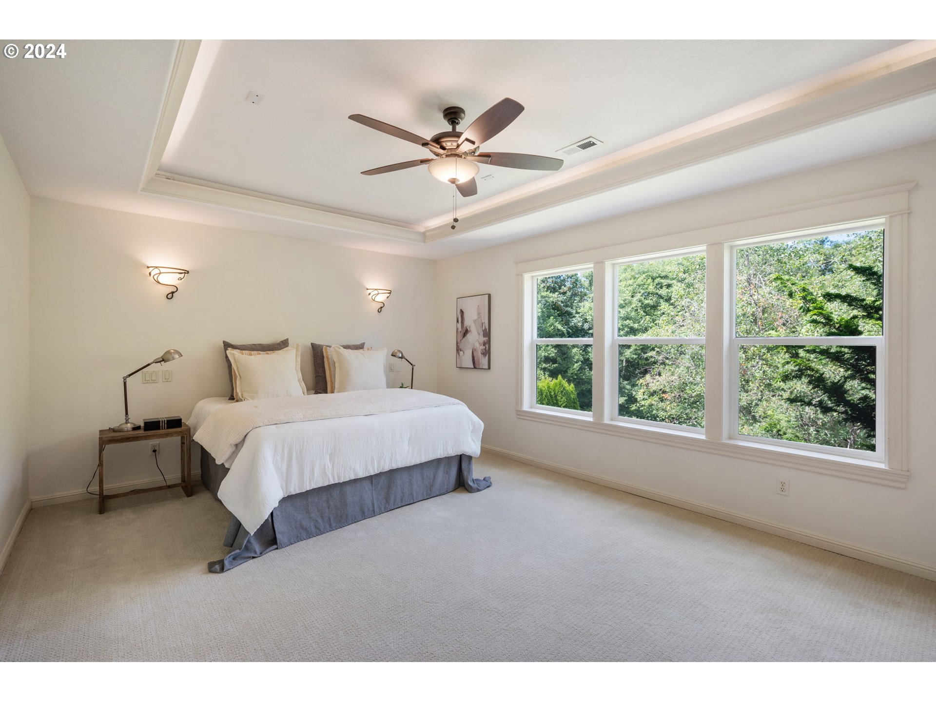 2204 South 17th Way Ridgefield, WA 98642 - Photo 21 of 45 a bedroom with a large bed and a large window