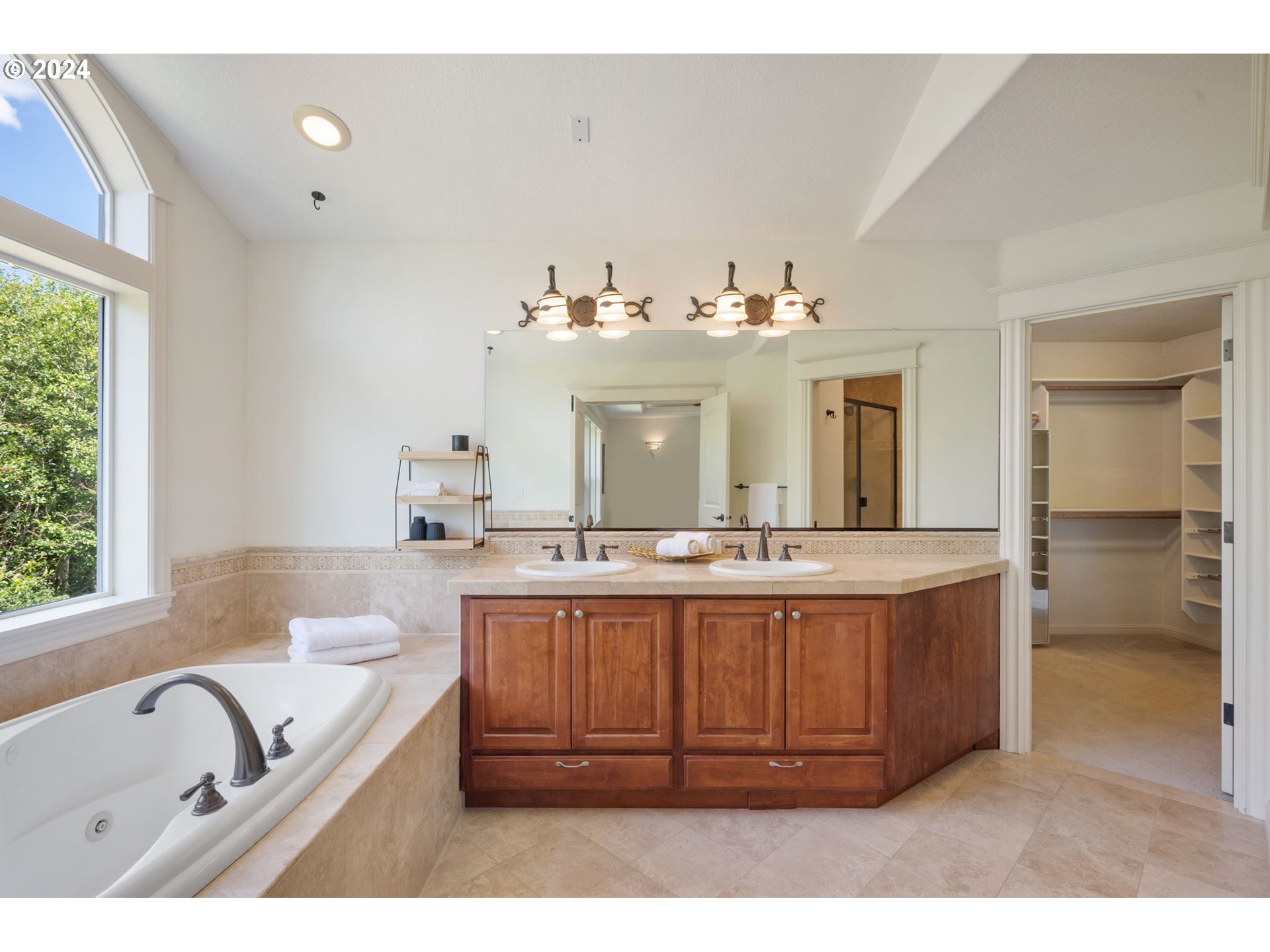 2204 South 17th Way Ridgefield, WA 98642 - Photo 24 of 45 a bathroom with a tub sink and mirror