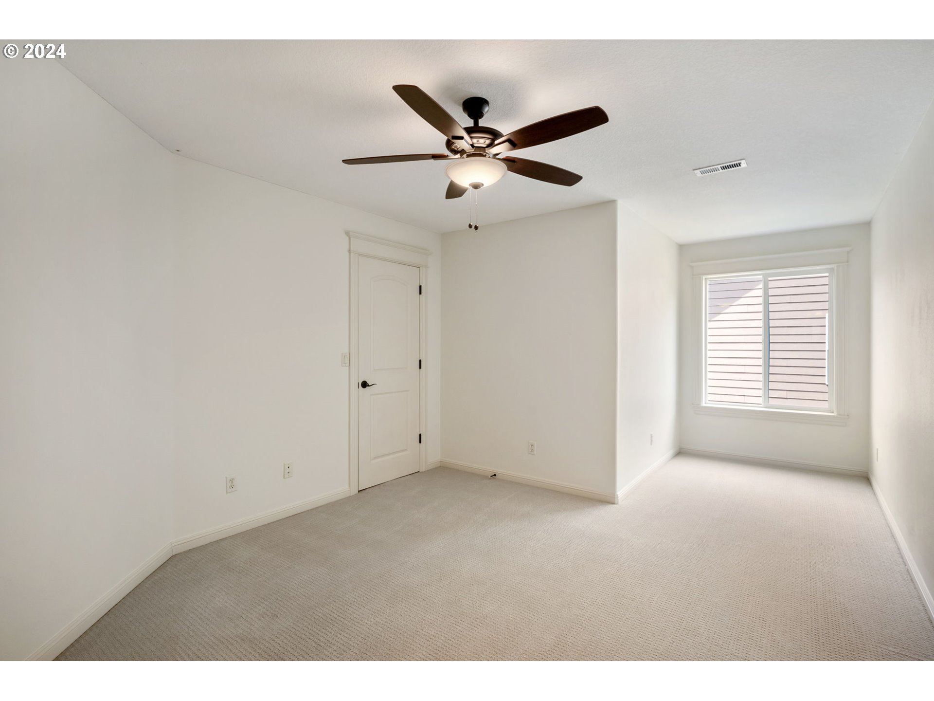 2204 South 17th Way Ridgefield, WA 98642 - Photo 28 of 45 a view of an empty room with a window